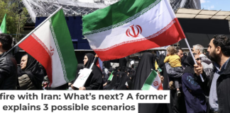 Iranians hold national flags in Tehran’s Revolution Square on April 8, 2026, after the United States and Iran agreed to a two-week ceasefire. Atta Kenare/AFP via Getty Images